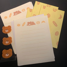 Load image into Gallery viewer, A set of cute stationery items featuring a bread pattern, including a lined notepad, matching memo pads, and three small teddy bear-shaped stickers on a black background.