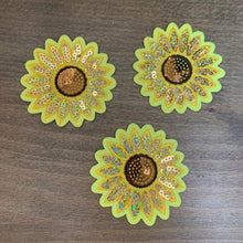 Load image into Gallery viewer, Three sparkly sunflower sequin patches with yellow petals, golden sequins, and intricate embroidery displayed on a wooden surface.