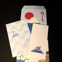 Load image into Gallery viewer, A set of Japanese-style art cards or postcards featuring Mount Fuji, displayed on a black background. One card shows a blue and white mountain pattern with a red sun, another shows a blue and white Fuji illustration, and a third is plain white with a small Fuji print.