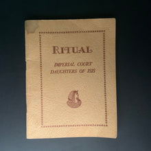 Load image into Gallery viewer, 1959 Daughters of Isis ritual booklet with pale pink cover and printed emblem