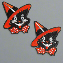 Load image into Gallery viewer, Vintage black cat iron-on patch with orange witch hat and red polka dot bow tie, 3 inches tall, detailed embroidery on gray background - perfect for Halloween costumes and jackets