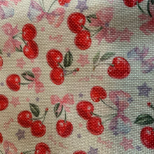 Load image into Gallery viewer, Close-up of ream canvas Kawaii cherry tote bag with embroidered red and pink cherries and purple bows, featuring a foldable and portable design for shopping