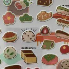 Load image into Gallery viewer, Add a touch of sweetness to your letters with our Japanese Sweets Washi Paper Stationery Set. Featuring cute and yummy illustrations of Japanese sweets, this set includes notepaper, stickers, washi tape, and envelopes, all beautifully coordinated.