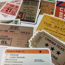 Load image into Gallery viewer, Add a touch of classic rock cool and international travel to your belongings with this pack of vintage-looking travel, concert, and sporting event ticket stickers! These stickers are perfect for embellishing laptops, luggage, water bottles, scrapbooks, notebooks, journals, and bikes.  The pack includes 48 high-quality decals
