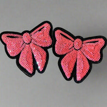 Load image into Gallery viewer, Two pink sequin bow patches displayed together