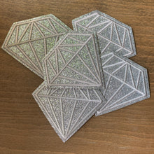 Load image into Gallery viewer, A close-up image of five identical glitter  diamond patches, each measuring 3 inches. The patches feature intricate embroidery with silver-colored thread outlining a sparkling, silvery glitter fabric diamond shape.