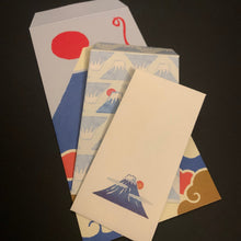 Load image into Gallery viewer, A stack of printed japanese envelopes with abstract geometric and wave-like mt. fuji patterns in blue, cream, red, and tan, photographed on a dark background.
