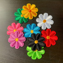Load image into Gallery viewer, Colorful flower-shaped patches on a dark surface
