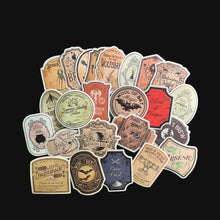 Load image into Gallery viewer, Collection of vintage-style apothecary stickers arranged in a circular pattern on a black background
