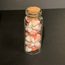 Load image into Gallery viewer, A small clear glass bottle with a cork stopper, filled with fresh and bloody finish mad scientist prop teeth, set against a dark background.
