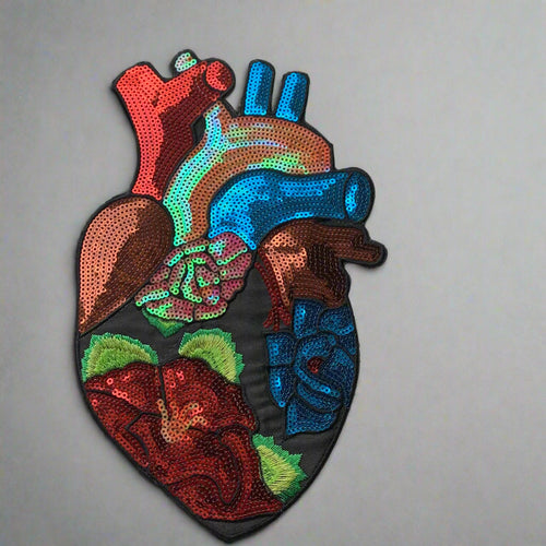 Large anatomical heart patch with colorful sequins showing medical accuracy and vibrant red blue green sequin details