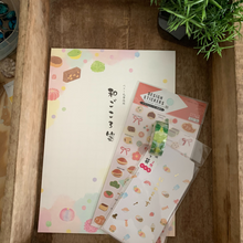Load image into Gallery viewer, Express your love for Japanese sweets through your letters with our Japanese Sweets Washi Paper Stationery Set. Featuring mochi, Dango, and more, this set includes notepaper, stickers, washi tape, and envelopes, all adorned with delightful dessert-themed illustrations.
