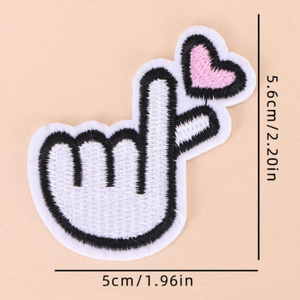 White embroidered Korean finger heart patches with pink hearts measure 2.2 x 1.96"