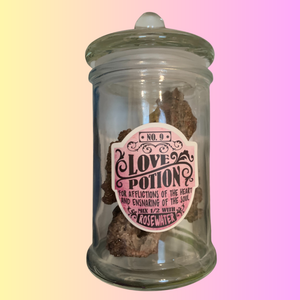 Love Potion no. 9 Apothecary Jar. Glass Jar with rubber sealed lid. Glass finial. Love Potion no. 9 Decal. Mix with Rosewater to soothe afflictions of the heart. Valentines Day, Halloween decor.