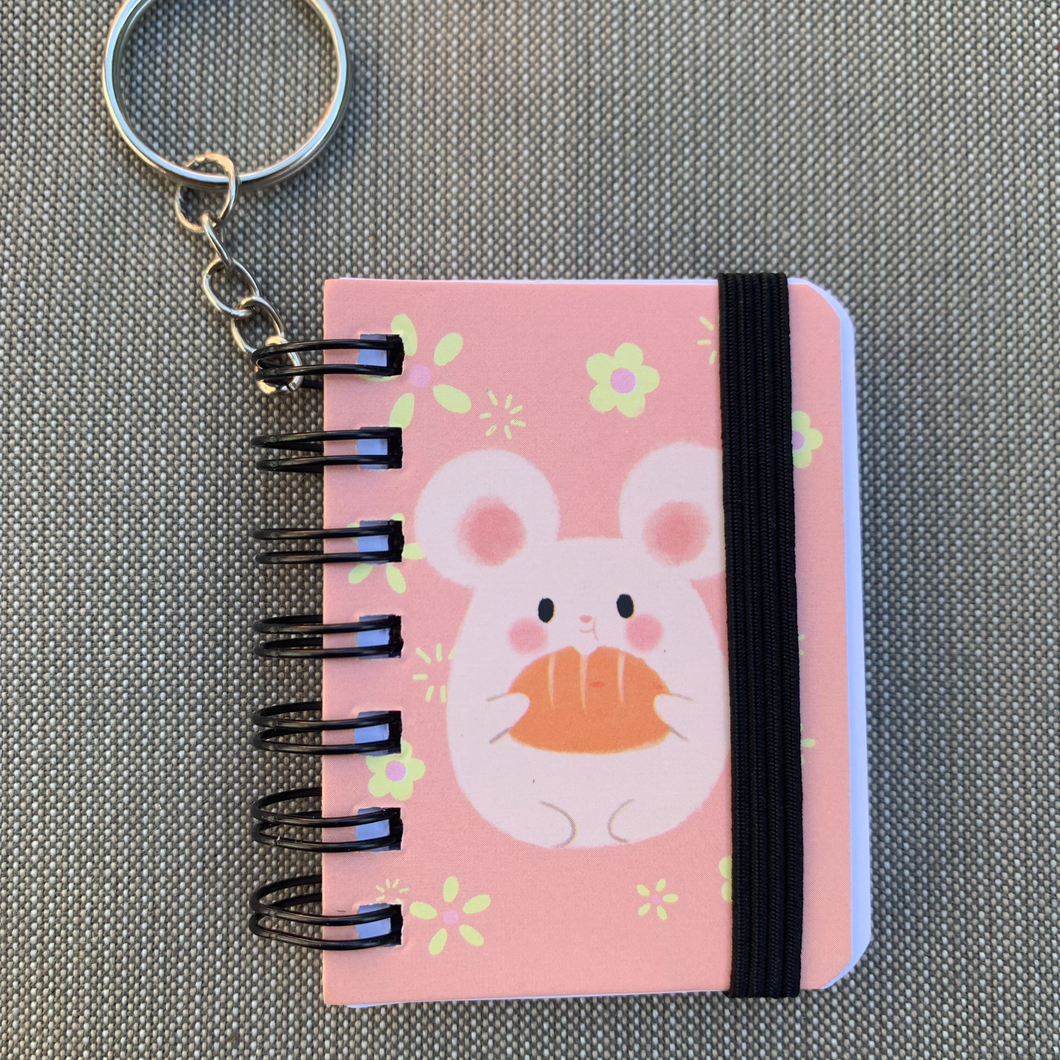 Pocket-sized perfection: These adorable keychain notebooks are your mini companions for big ideas!