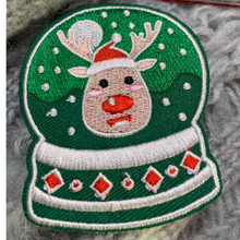 Load image into Gallery viewer, Elevate your holiday spirit and DIY creativity with our Christmas Decorative Embroidered Patches 6/pc set. This collection of festive patches features iconic Christmas symbols – a Christmas Tree, two Snowglobes, a Holiday Ornament, a calendar page, and Rudolph the Red-Nosed Reindeer – perfect for adding a touch of yuletide charm to your clothing, stockings, gifts, and of course, Ugly Sweaters.
