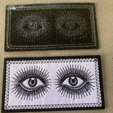 Load image into Gallery viewer, Vintage-look eyes iron-on patch reverse side and front. Shown against linen background
