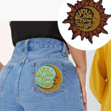 Load image into Gallery viewer, iron on sun and moon large embroidered boho patches 2pk on jeans pocket
