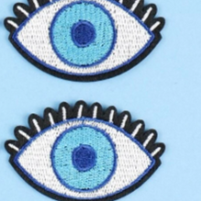 Load image into Gallery viewer, Elevate your style and ward off negativity with our Embroidered Evil Eye Magic Patches 2-Pack, available in captivating navy, serene teal, or classic white. This enchanting duo of patches is beautifully embroidered with the ancient symbol of protection, the &quot;Evil Eye,&quot; known to safeguard against ill intentions and negative energies. Light blue iris from elementah.com
